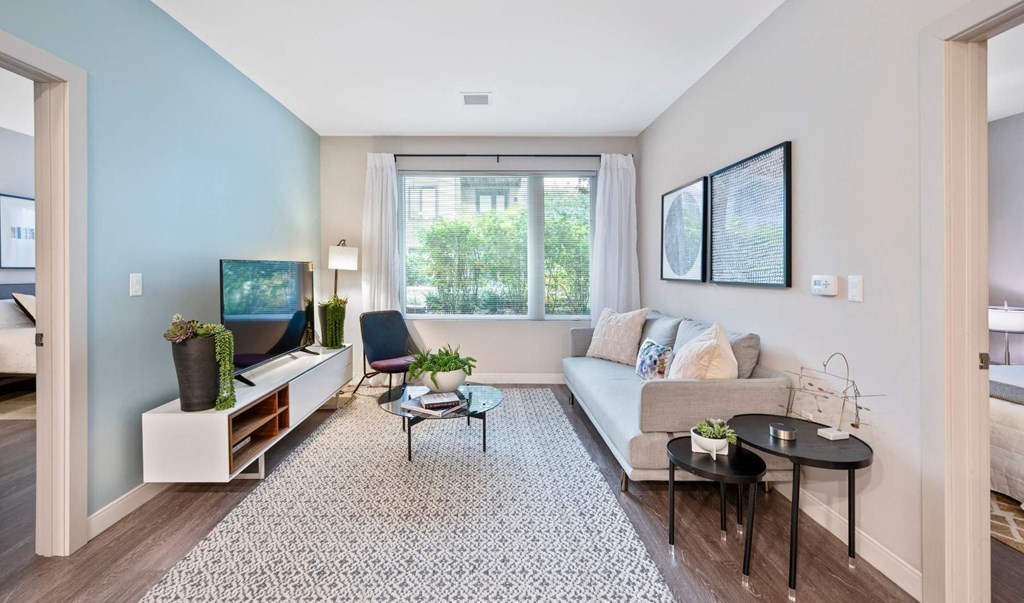 a living room with a couch and a window