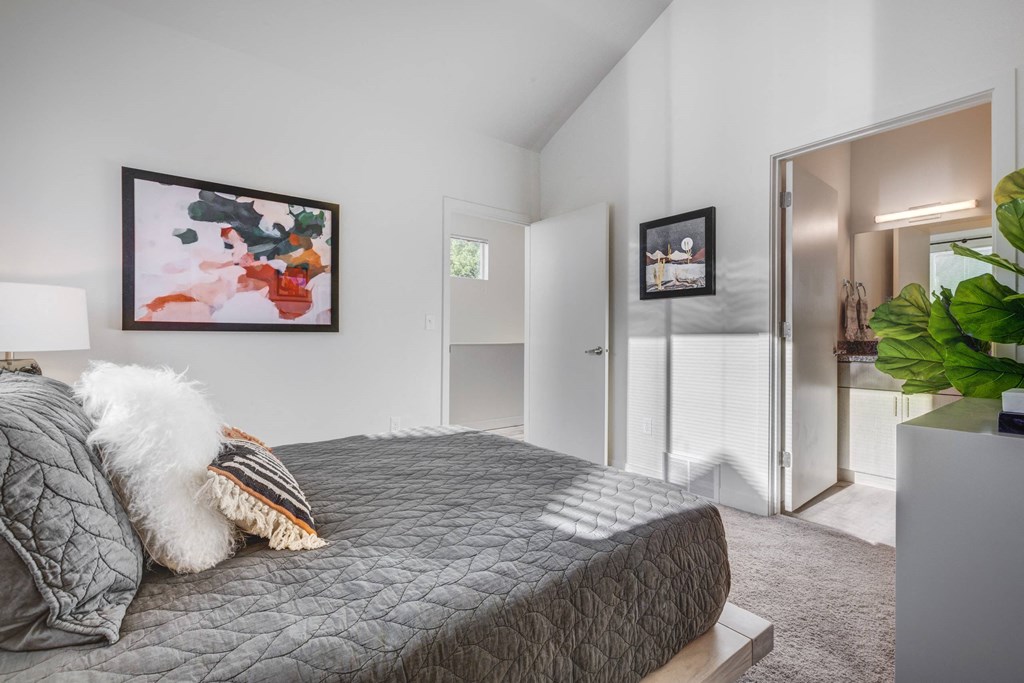 a bedroom with a large bed and a closet