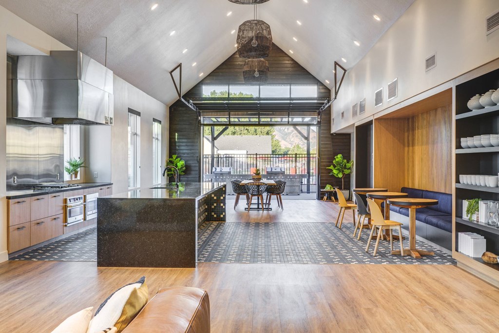 a living room with a kitchen and a dining room
