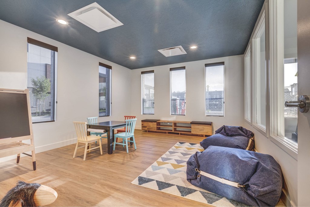 a living room with a couch and a table and a tv