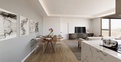 A modern kitchen with a dining table and chairs.
