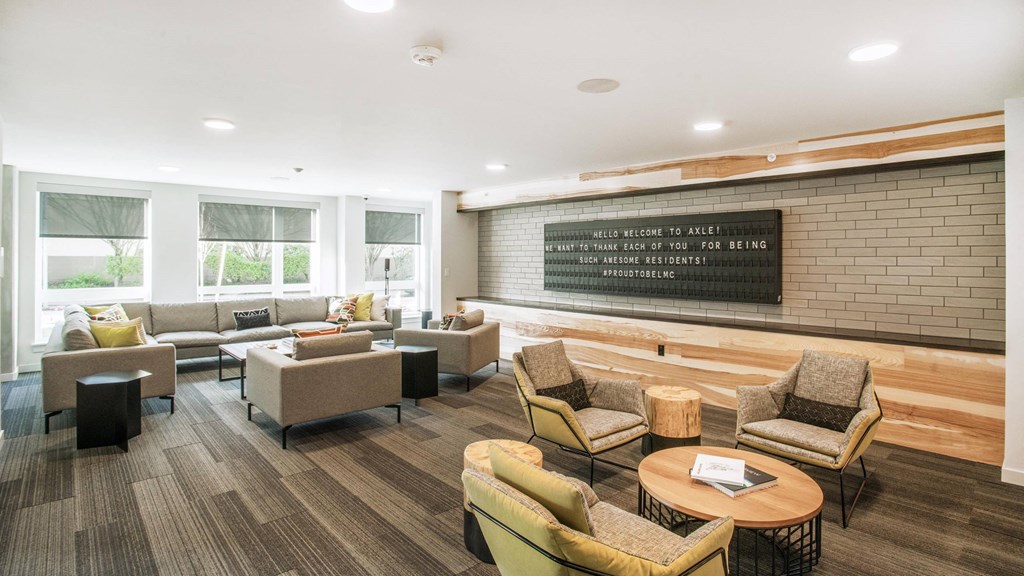 A waiting room with a sign that says at Axle, Seattle, 98119