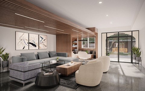 A modern living room with a grey sofa, a wooden coffee table, and a large abstract painting on the wall.