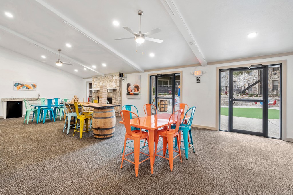 A room with a table and chairs in it.
