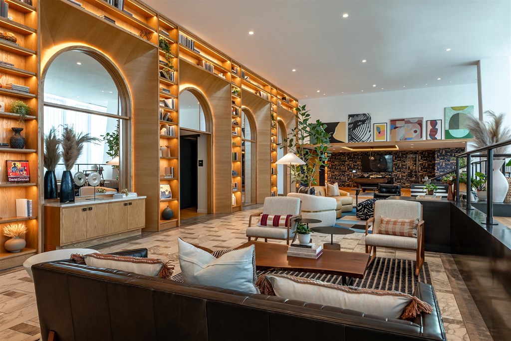 A modern living room with a large couch and a coffee table.