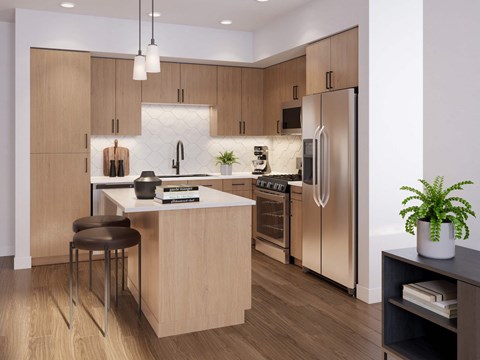 A modern kitchen with a wooden island and stainless steel appliances.