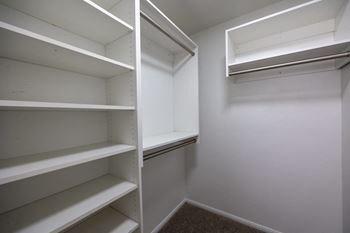 Empty white shelves in a room.