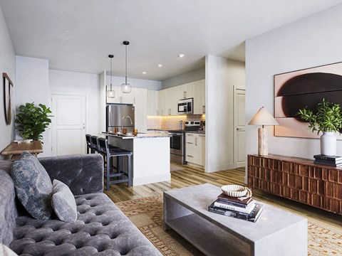 A modern living room with a grey sofa and a coffee table.
