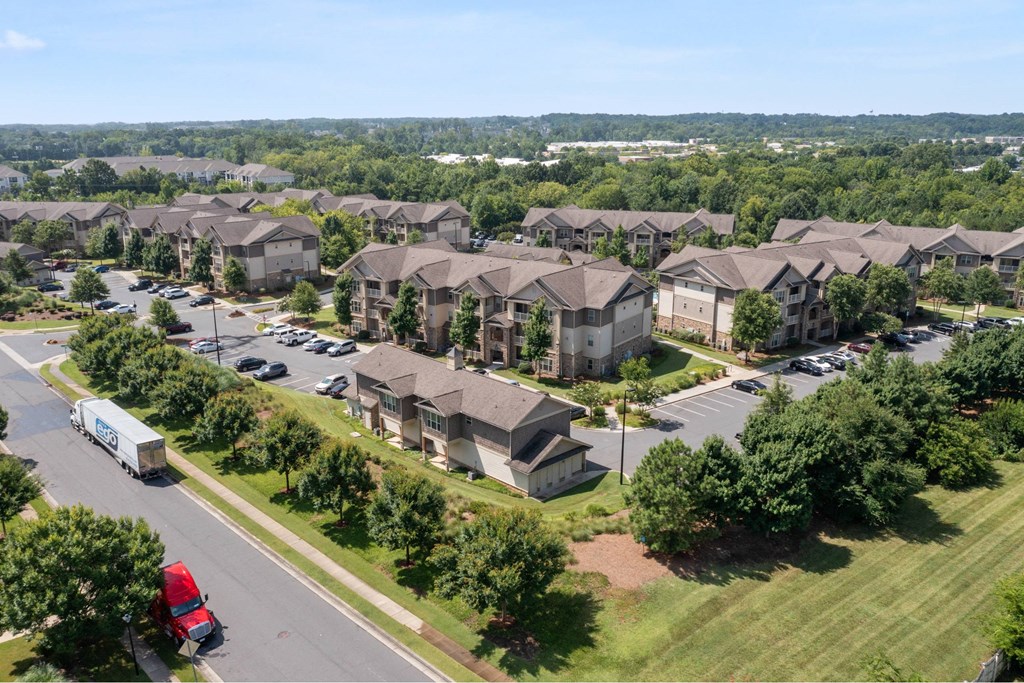 A large group of houses are seen from an aerial view.