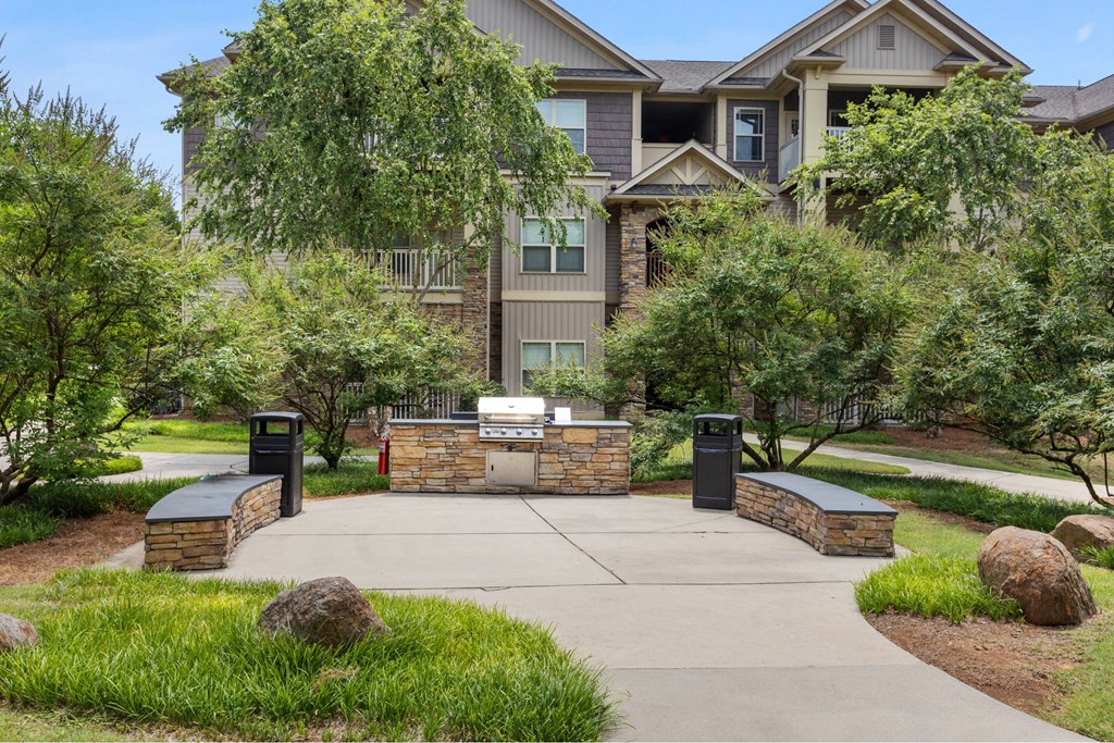 A large house with a driveway and a gate.