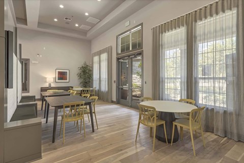 A modern dining room with a glass door leading to a balcony.