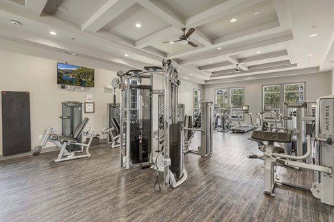 A spacious home gym with a variety of equipment.