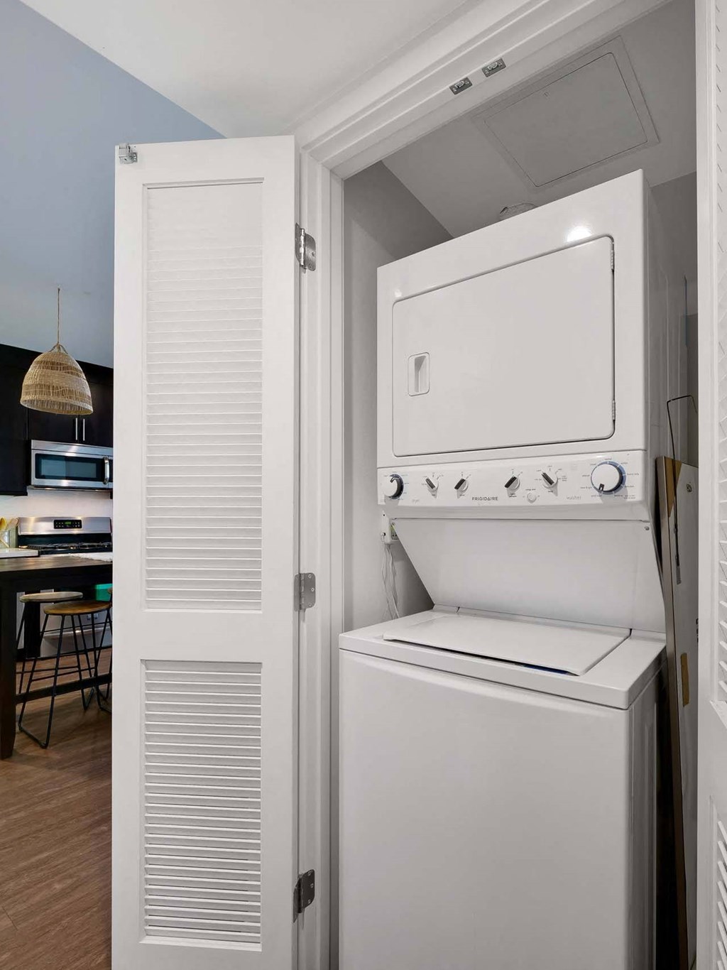 A white refrigerator and freezer are in a kitchen.
