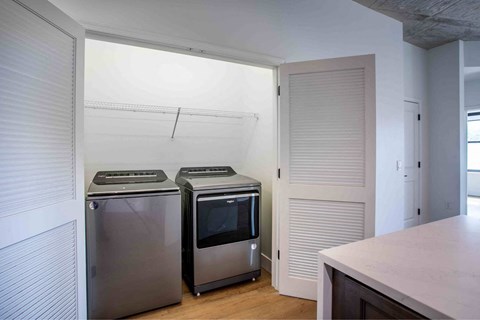 Two stainless steel ovens are in a kitchen.