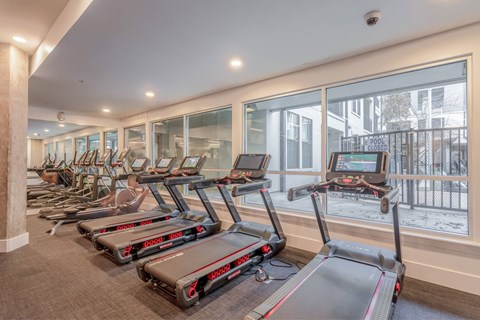 A gym with treadmills and a sign that says closed.