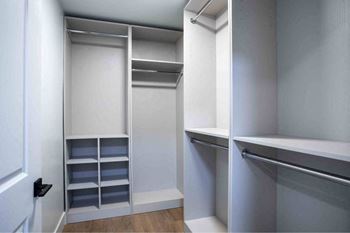 A white closet with shelves and drawers.