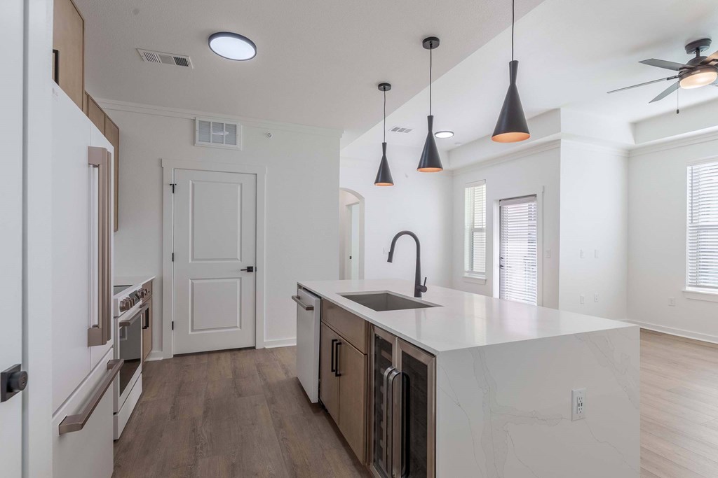 Five810 Southlands, Aurora, CO, Premium A kitchen with a white counter top and a ceiling fan.