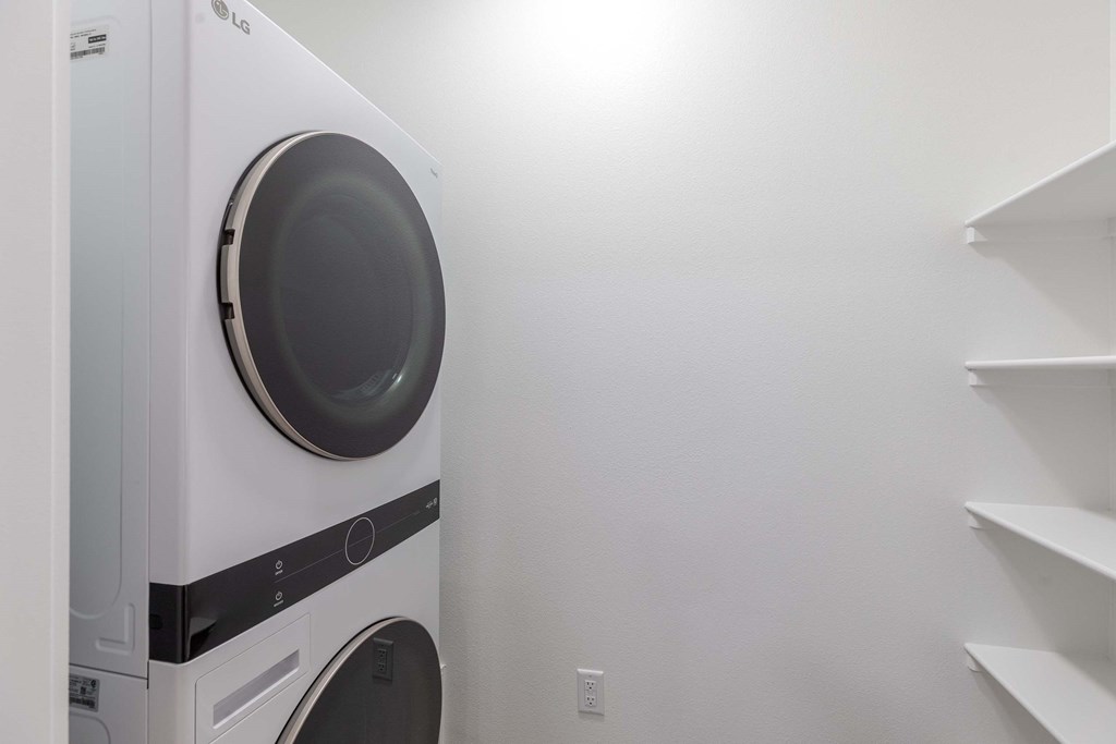 A white LG washing machine in a laundry room.