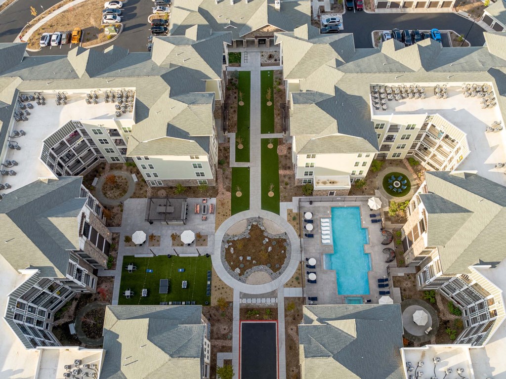 A bird's eye view of a courtyard surrounded by buildings.