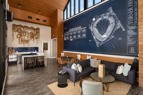 A room with a blue wall and a drawing of a tunnel.