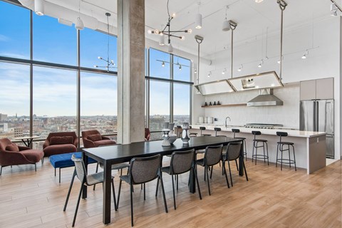A modern kitchen with a dining table and chairs.