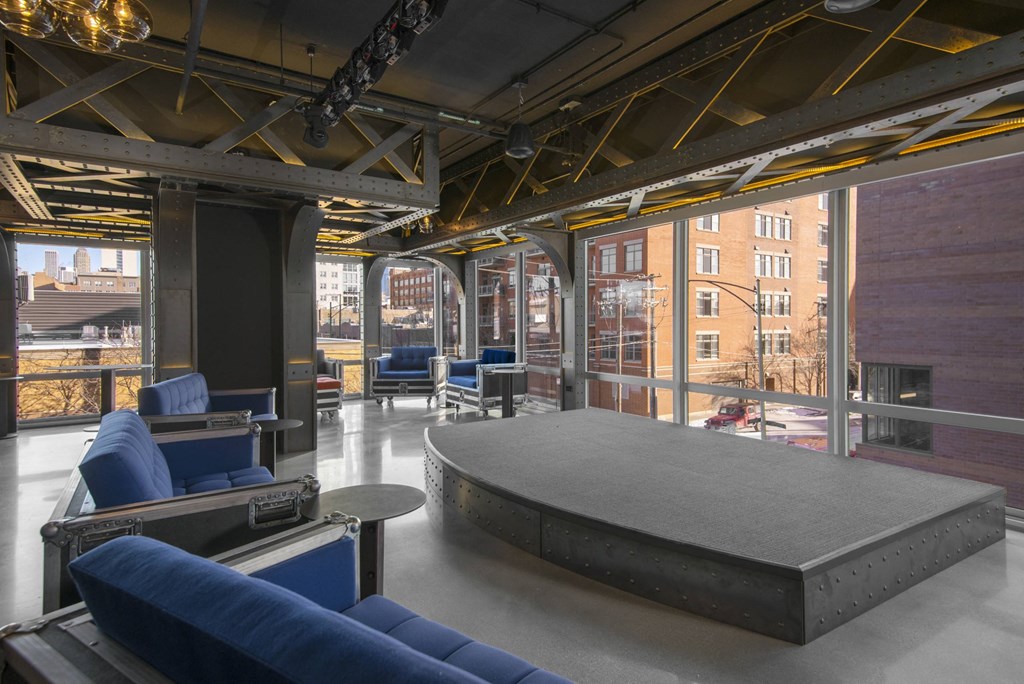 A large open space with a stage and seating area.