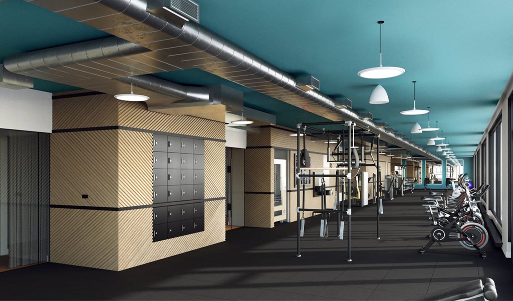 A modern gym with exercise equipment and mirrors on the wall.