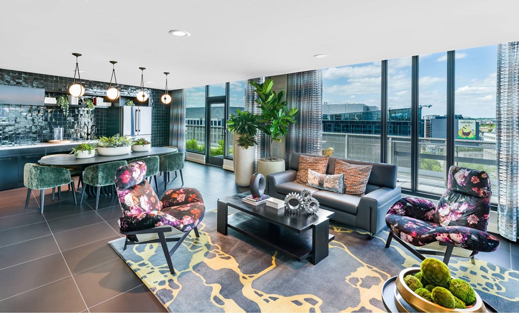 A modern living room with a large window and a view of the city.