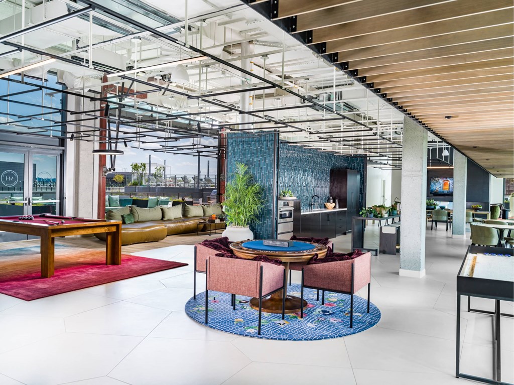A modern dining area with a round table and chairs.