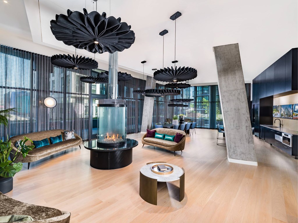 A modern living room with a fireplace and a large sculpture.