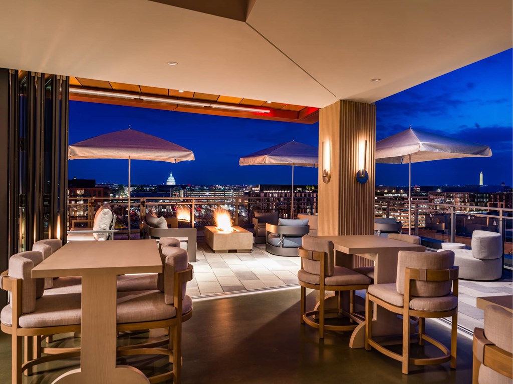 A restaurant with a view of the city at night.