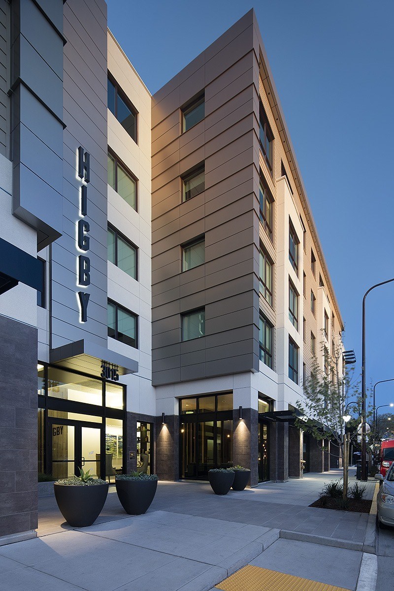 The image shows a modern building with the name 