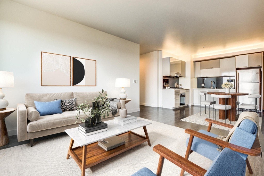 A modern living room with a white couch and a coffee table.
