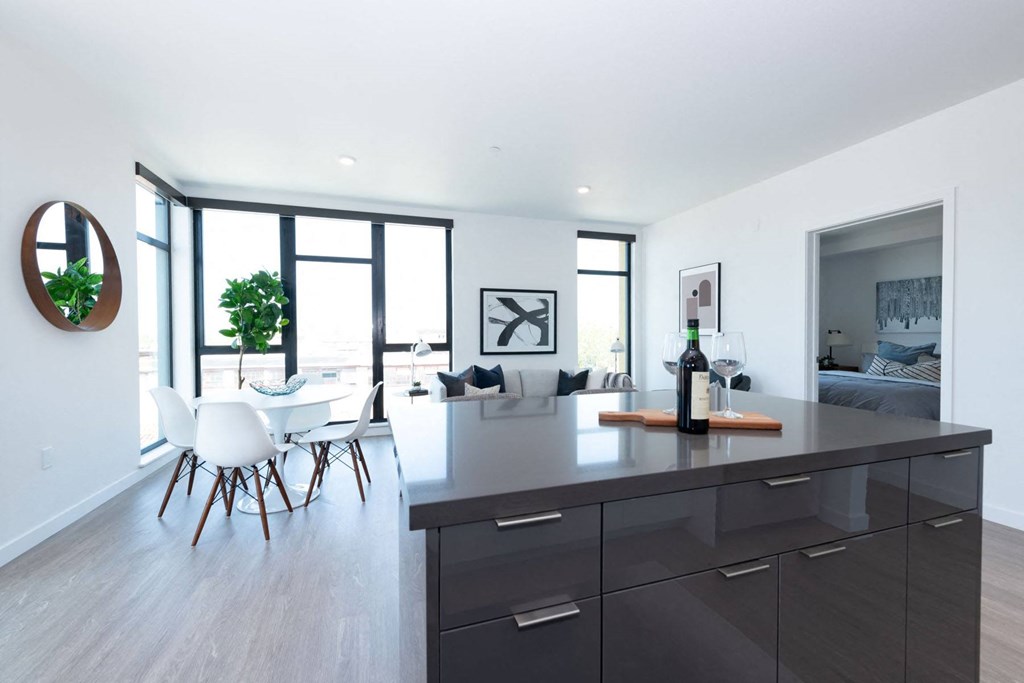 a kitchen island with a bottle of wine on it