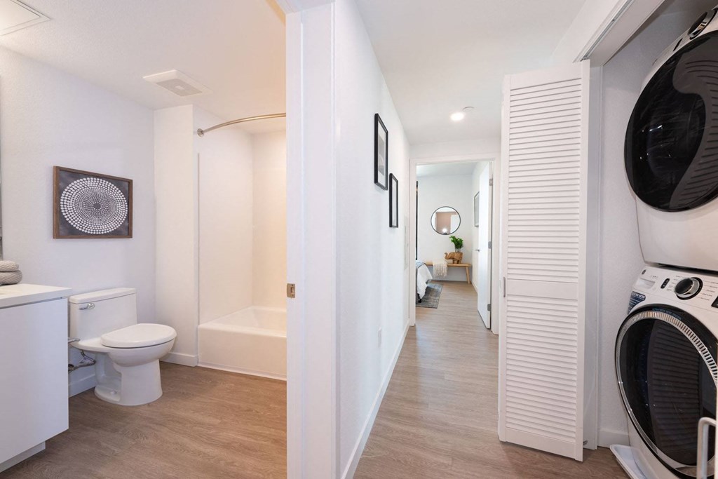 a bathroom with a washer and dryer