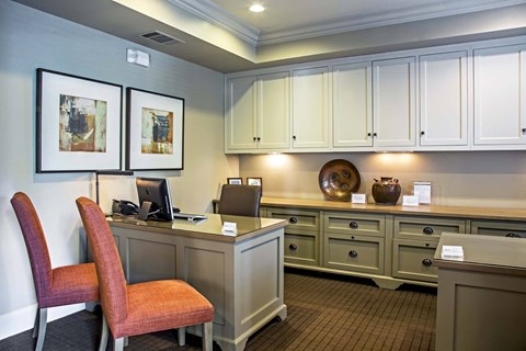 A room with a desk and a chair.