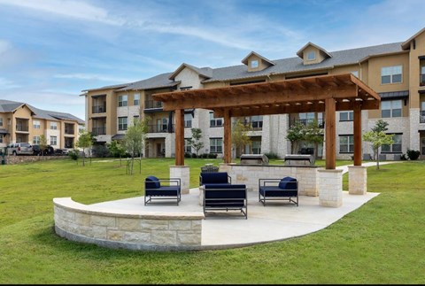 A large building with a covered seating area in front.