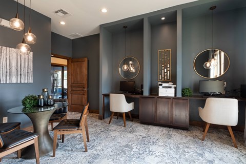 A modern living room with a grey carpet and a wooden cabinet.