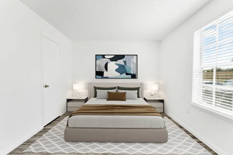 A bedroom with a large bed and a painting above it.