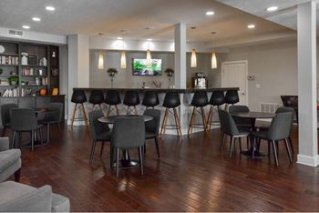 A room with a long table and chairs.
