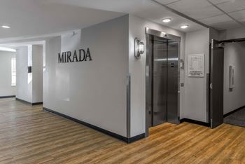 A hallway with a sign that says "MIRADA" on the wall.