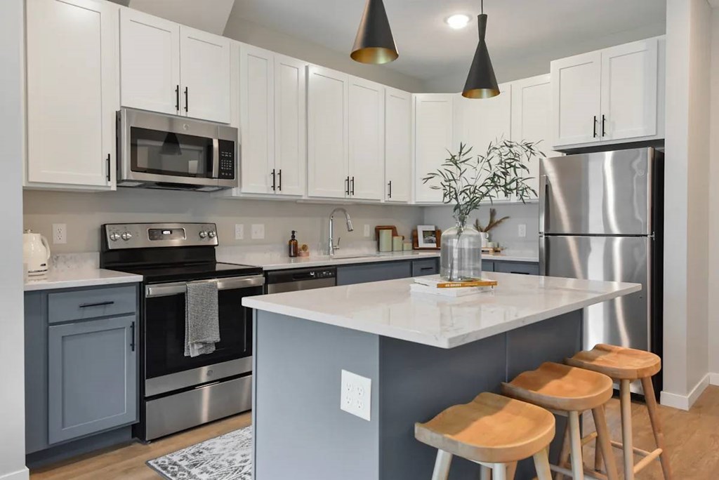 Kitchen with white countertop at The Lodge at Overland townhomes for rent in Rochester, MN.