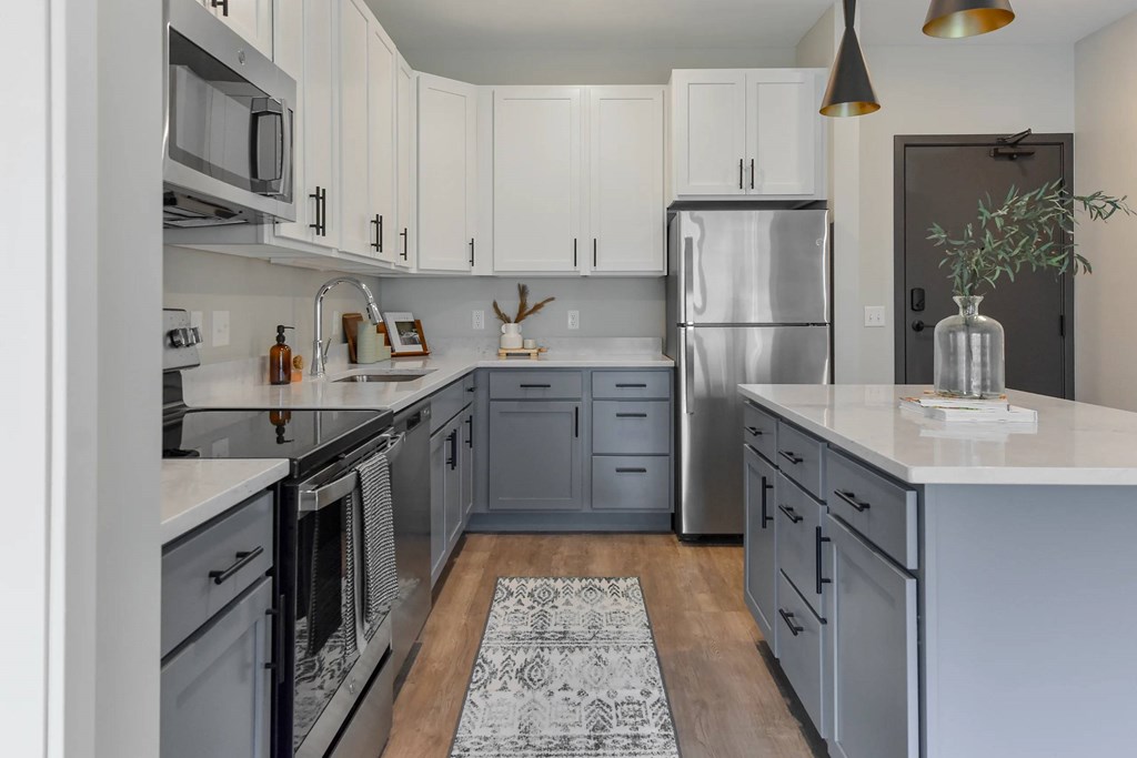Kitchen with stainless appliances at The Lodge at Overland new apartments in Rochester, MN.