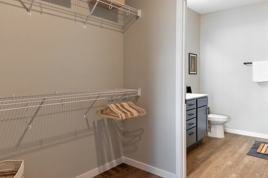 A bathroom with a towel hanging on a rack.