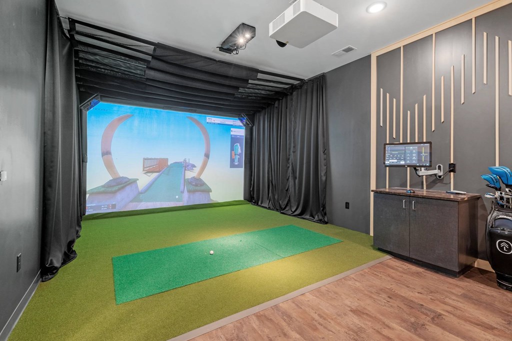 A golf simulation room at The Lodge at Overland luxury apartments in Rochester, MN.