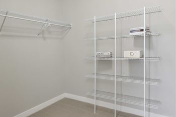 Empty shelves in a room with white walls.