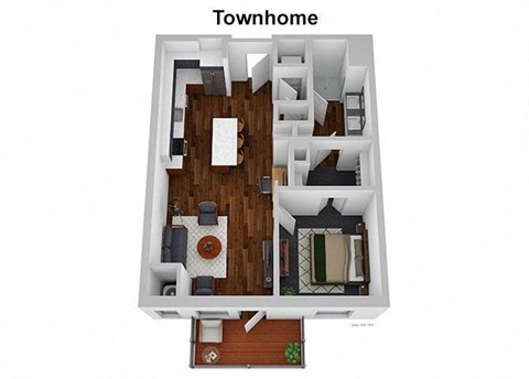 A top down view of a small townhouse with a living room, dining room, kitchen, and bedrooms.