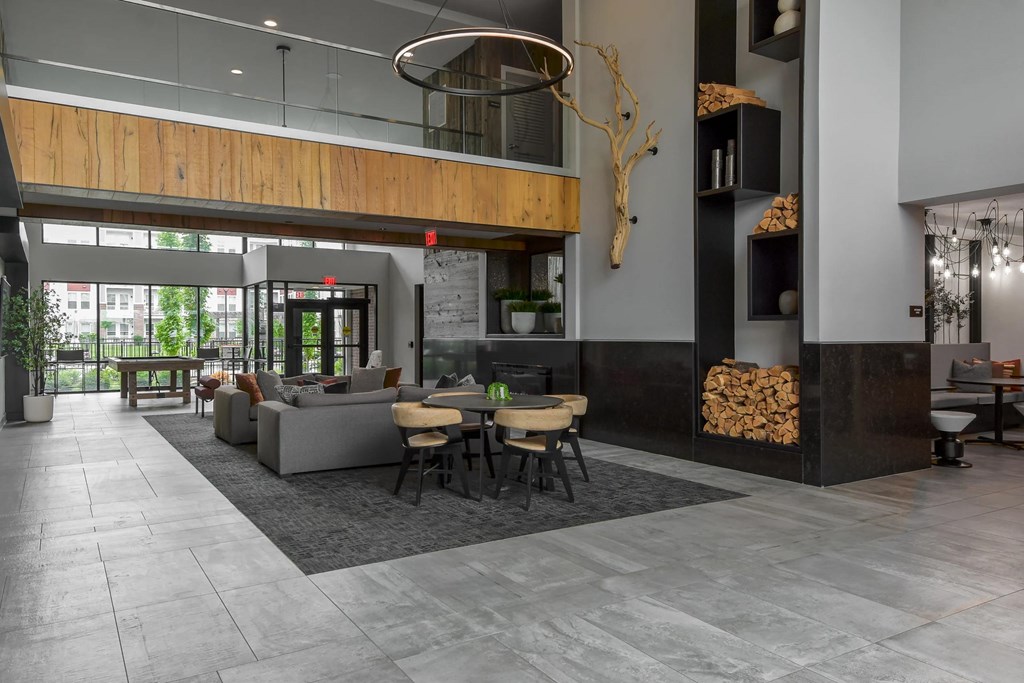 A modern living room with a fireplace and a dining table.