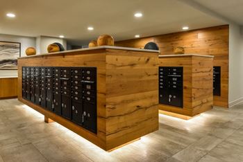 A wooden bar with black drawers and a counter.