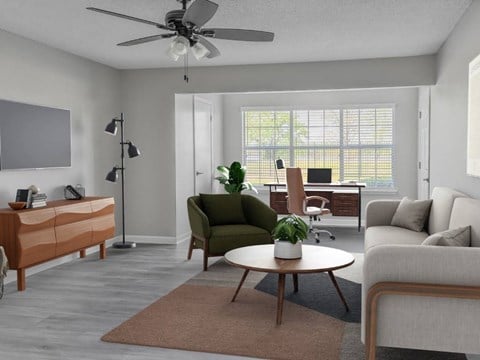 A living room with a green chair and a brown rug.